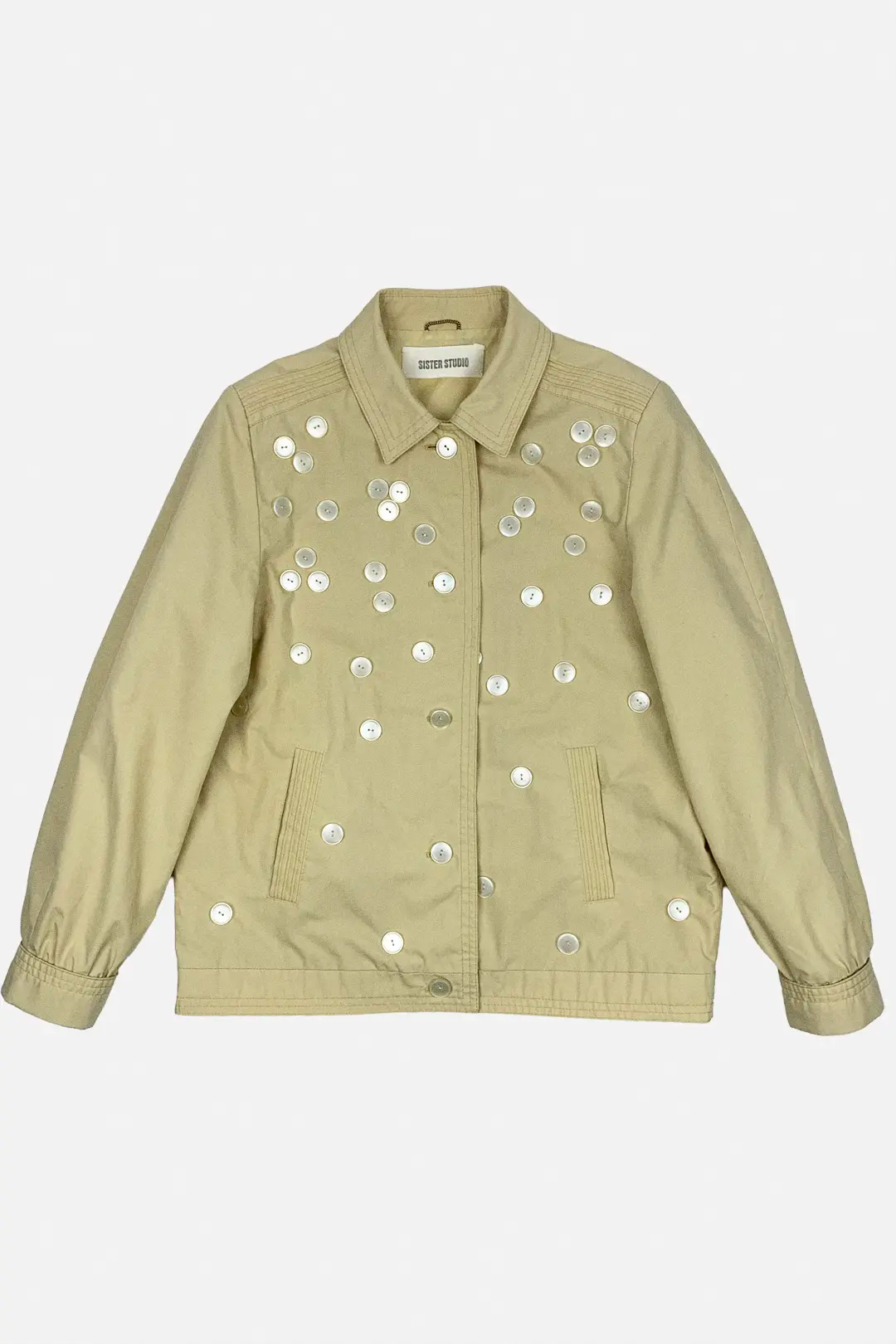 Butter yellow jacket with beige button embellishments on a white background