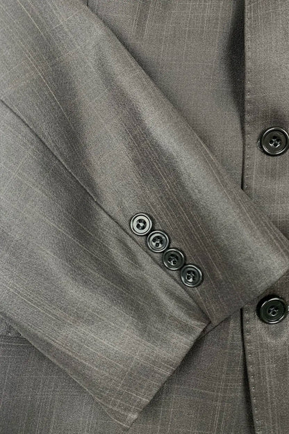 Close-up of a dark brown suit jacket with buttons