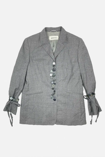 Gray blazer with button details on a white background