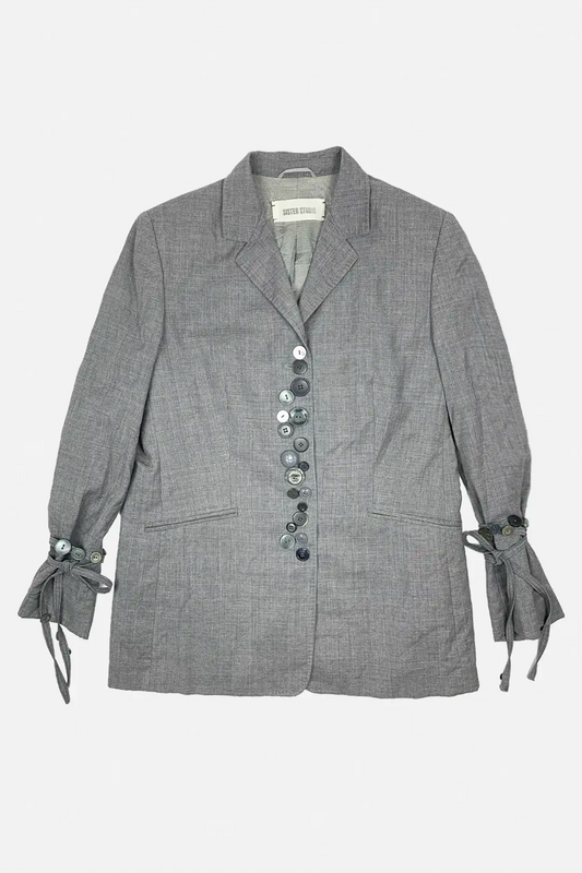 Gray blazer with button details on a white background