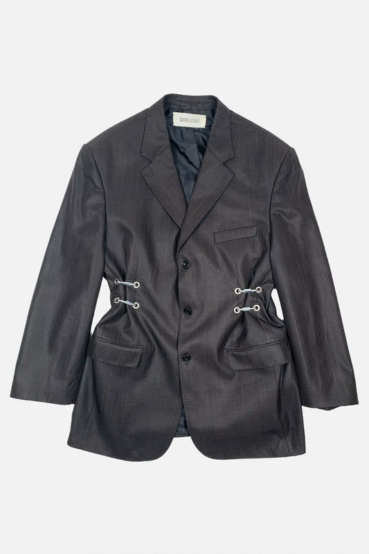 Dark brown blazer with silver hardware on a light gray background