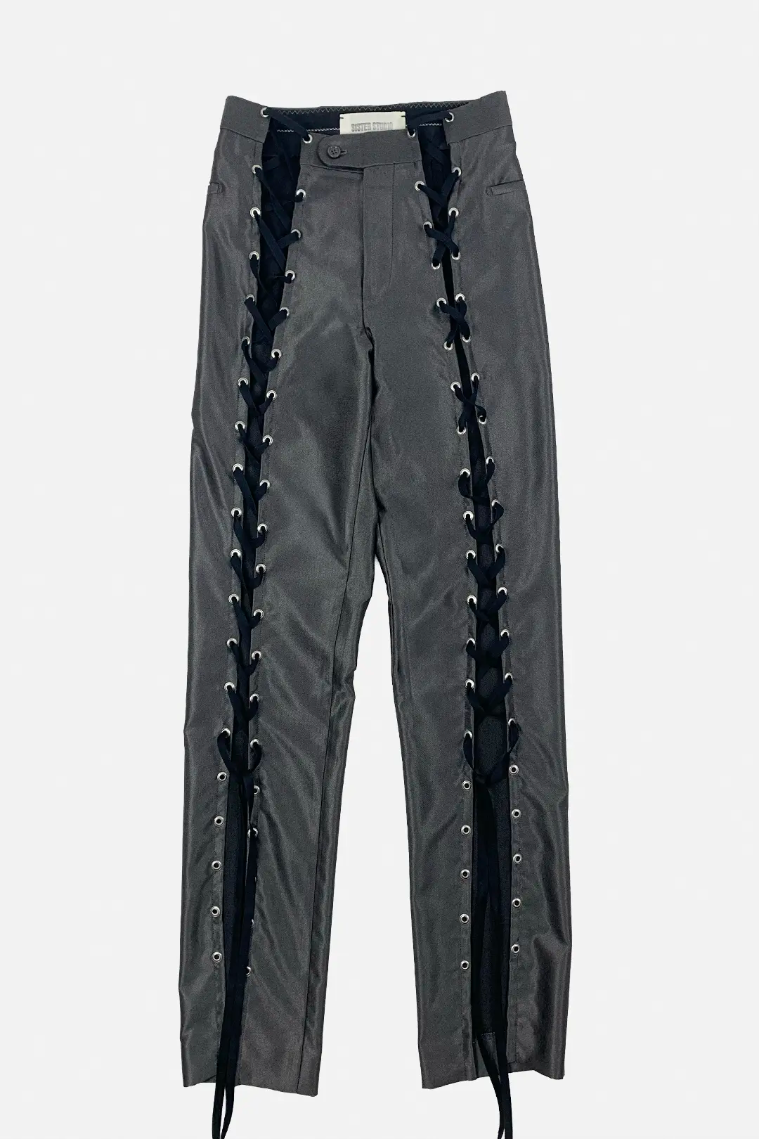 Dark gray pants featuring prominent black lace-up detailing running down both sides with silver metal eyelets, shown against a light gray background.