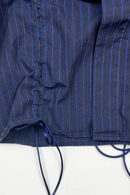 Close-up of a blue pinstripe shirt with a white background