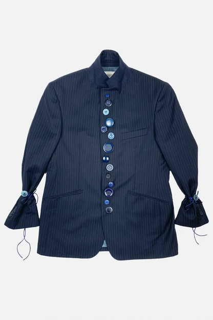 Navy pinstripe jacket with decorative buttons on a light gray background