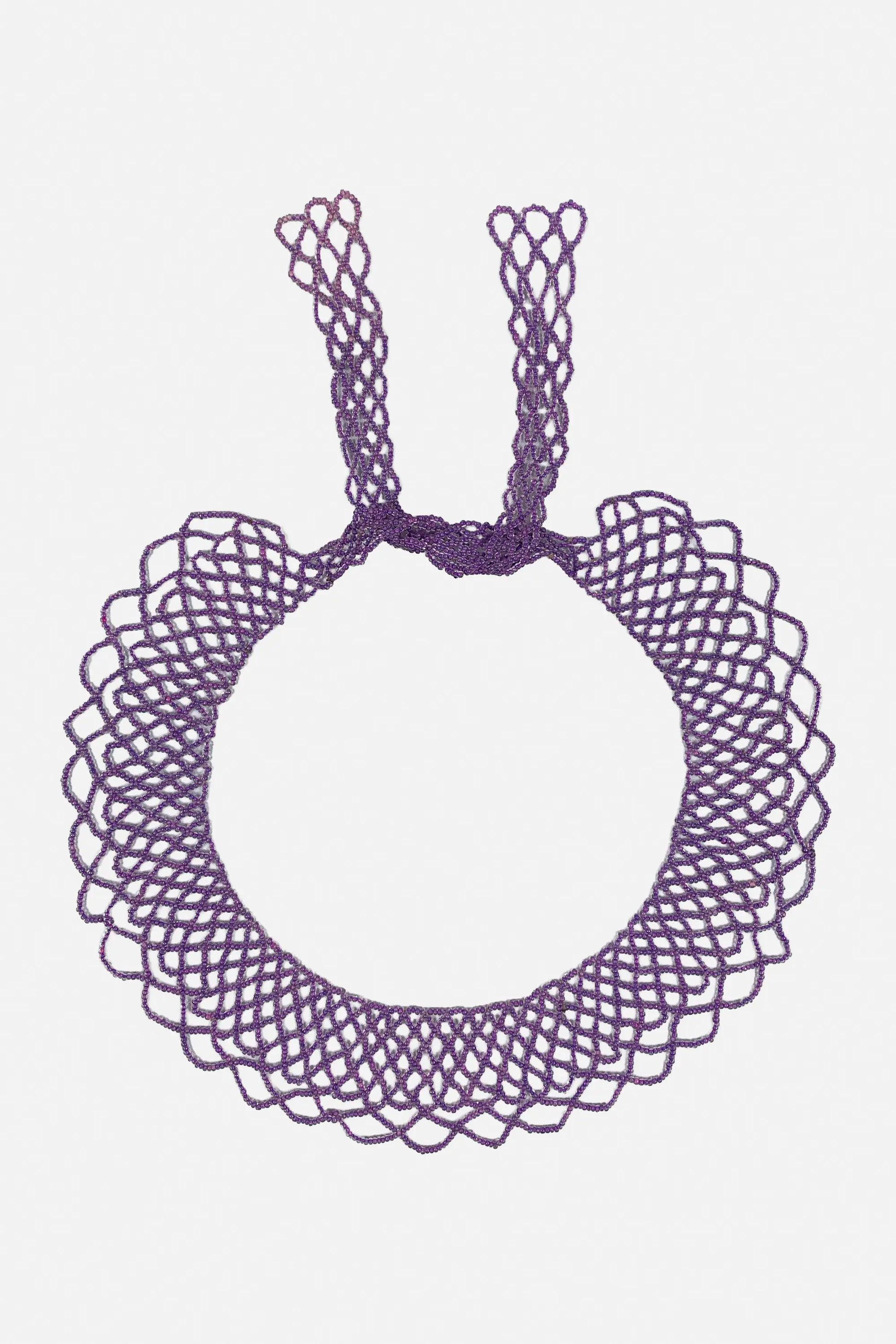 A purple macrame-style ring necklace with two knotted top loops, shown flat against a light gray background.